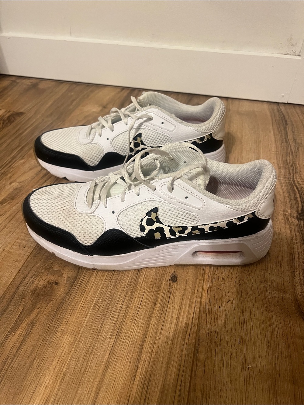 Nike White and Black Sneakers with Leopard Swoosh